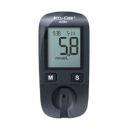 Accu-Chek Active Kit blood glucose meter showing a 5.8 mmol/L reading